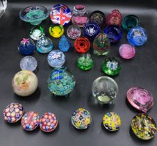 Twenty two assorted Caithness paper weights varying sizes and colours along with ten unnamed paper