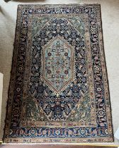 Blue wool ground rug 162cm x 104cm.