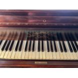 A Broadwood and Sons grand piano in Rosewood. 230cm l x 137cm w x 95cm h.