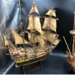 Model Sailing Ships, comprising a hand painted galleon with waxed sails, largest 66cm h x 57cm l, on