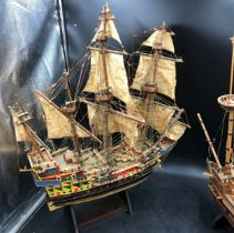 Model Sailing Ships, comprising a hand painted galleon with waxed sails, largest 66cm h x 57cm l, on