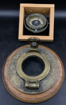 Shipping interest- A wooden and brass porthole with small glass window (glass 10cm d) and a gimble