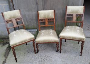 Three Edwardian rosewood and inlaid chairs, a pair and one single nursing chair.