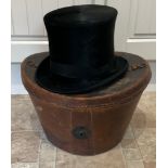 A 19thC leather top hat box and hat. 25cm h.