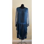 A 1920's blue drop waisted dress with chiffon sleeves, embroidery to front and cuffs and pleated