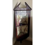An Edwardian mahogany corner cupboard with single glazed door and velvet lined interior 132h x 40w x
