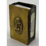 A 19thC brass matchbox holder depicting a dog's face in relief to the front. Approx. 6 x 4cm