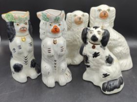 A collection of 19thC Staffordshire dogs to include a hand painted white and gold pair of dogs and