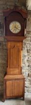 An oak longcase clock with brass face, maker John Gilbertson Ripon 222 x 52cm.