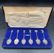 A set of six hallmarked silver Jubilee commemorative spoons each with a different novelty finial