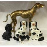 Of interest to dog lovers. Pair of Staffordshire pottery seated dogs with gilt details 27cm h, a