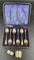 Set of six boxed silver teaspoons 1904 C W Fletcher & Son Ltd along with two napkin rings one