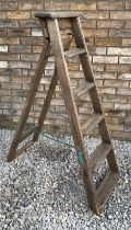 A pair of vintage pine folding stepladders. 124cm h x 44cm w at base.