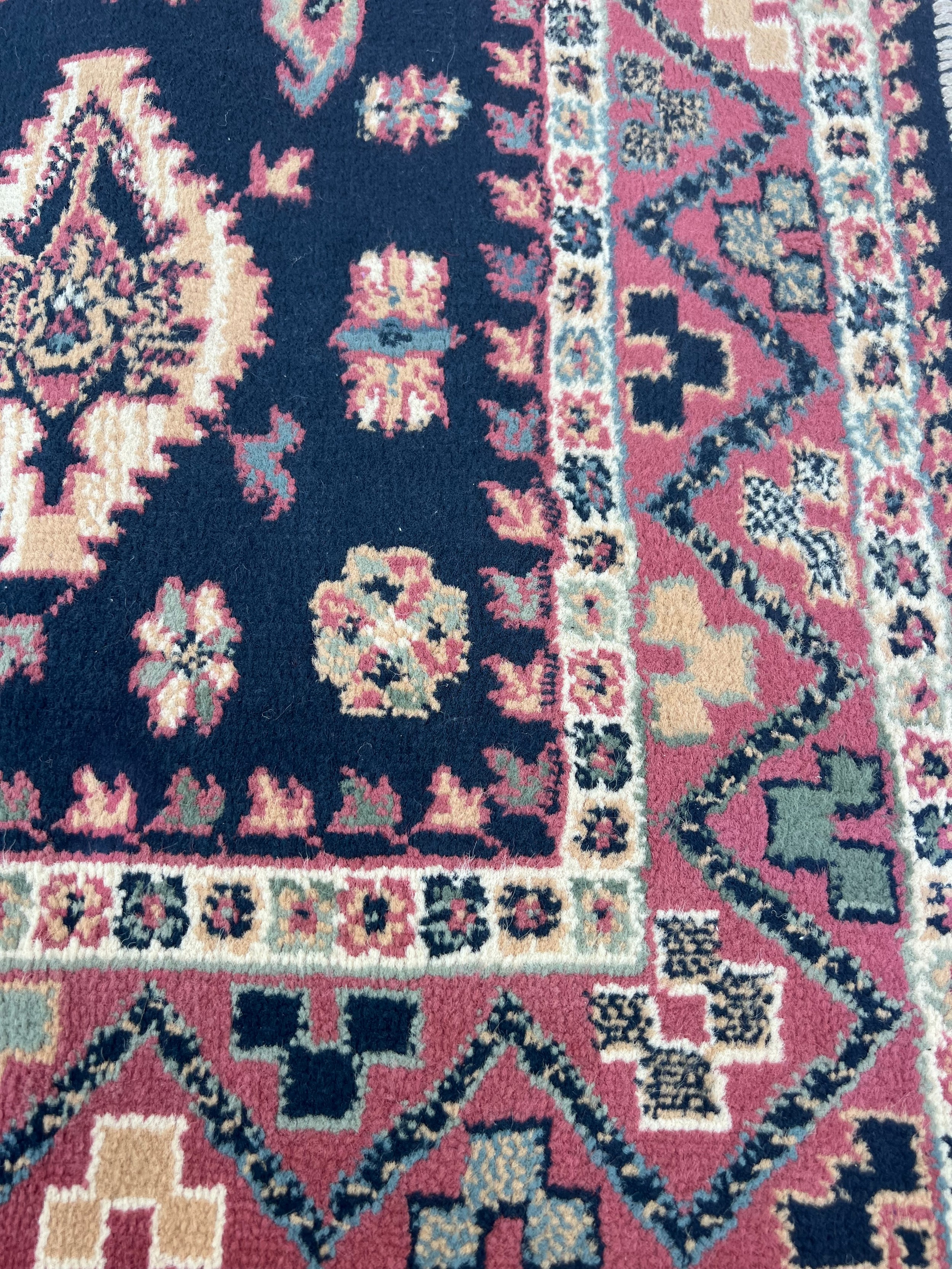 A vintage hand knotted blue/pink ground wool rug. 120 x 160cm. Possibly a Pakistan White Talim rug. - Image 2 of 4