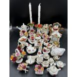 Royal Albert old country roses - a large quantity to include clock, pair of candlesticks, 10x flower