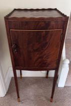 A mahogany bedside cabinet with satinwood toes. 34.5 x 35.5 x 81cm h.