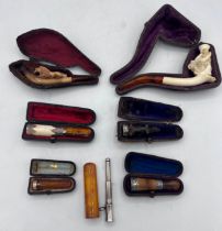 Smoking related items including two meerschaum pipes, silver mounted cheroot holders etc.