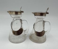 A pair of silver topped whisky noggins with silver labels London 1906 by G & S Co Ltd,