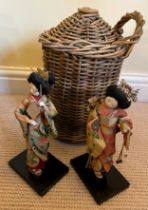 Two 1960’s Japanese costume dolls together with a harvest cider flagon in basket work holder 34cm h.