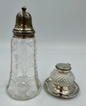 A glass inkwell with silver top and base, Chester 1905, maker's mark rubbed together with a glass