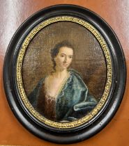 An oil on board portrait of a lady in an ebonised and gilt frame. 23cm x 20cm.