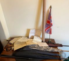 Five vintage umbrellas and a flag waved at the visit of Edward VII to Hull by a young Richard Scott.