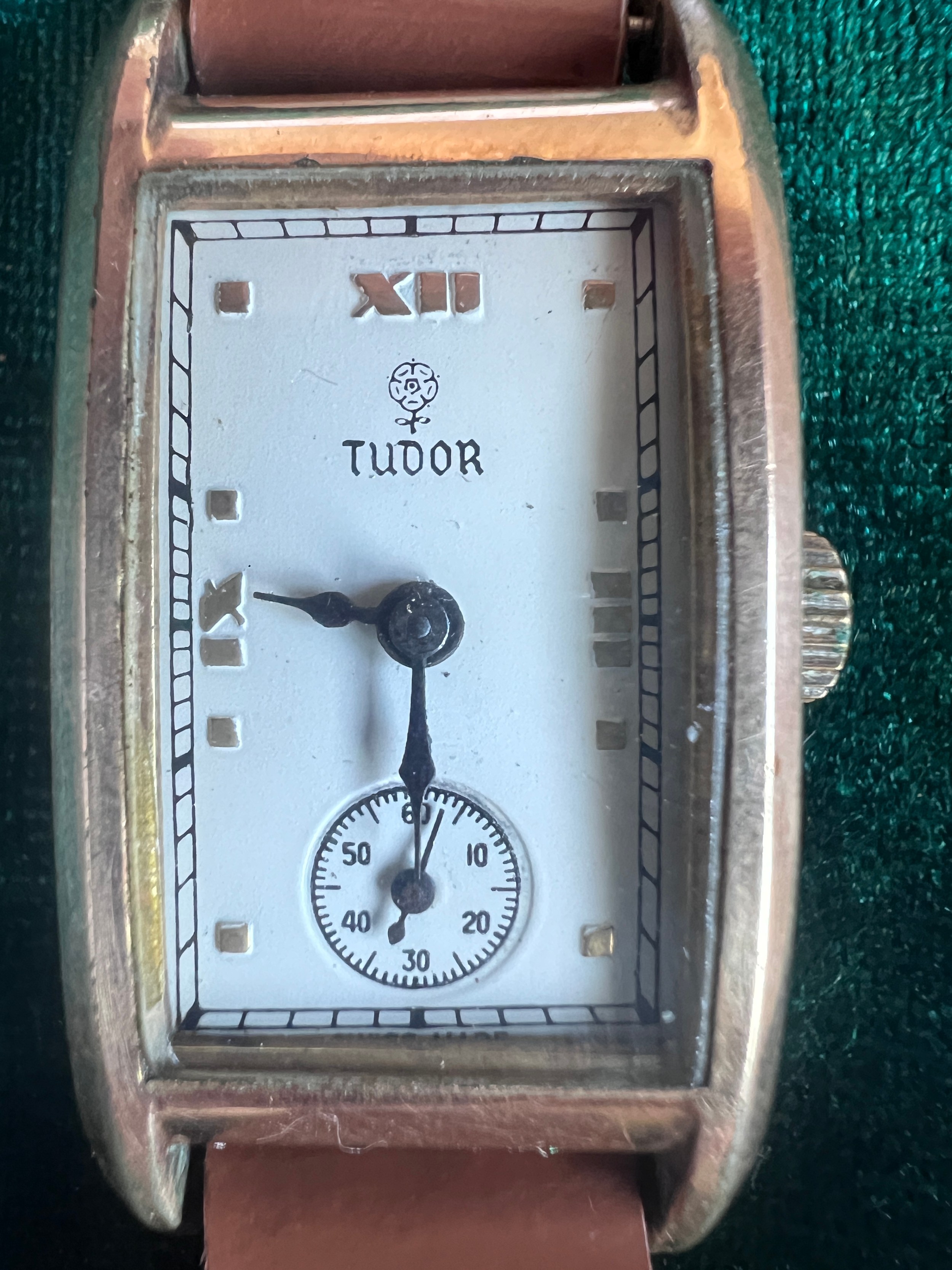 A Rolex Tudor gold plated, Art Deco, hand winding wristwatch on brown leather strap in green Rolex