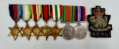 A Multi-Campaign medal group to include The 1939-1945 Star, The Atlantic Star, The Africa Star,