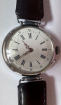 A vintage military trench watch. Winds and ticks. Grinds when wound.