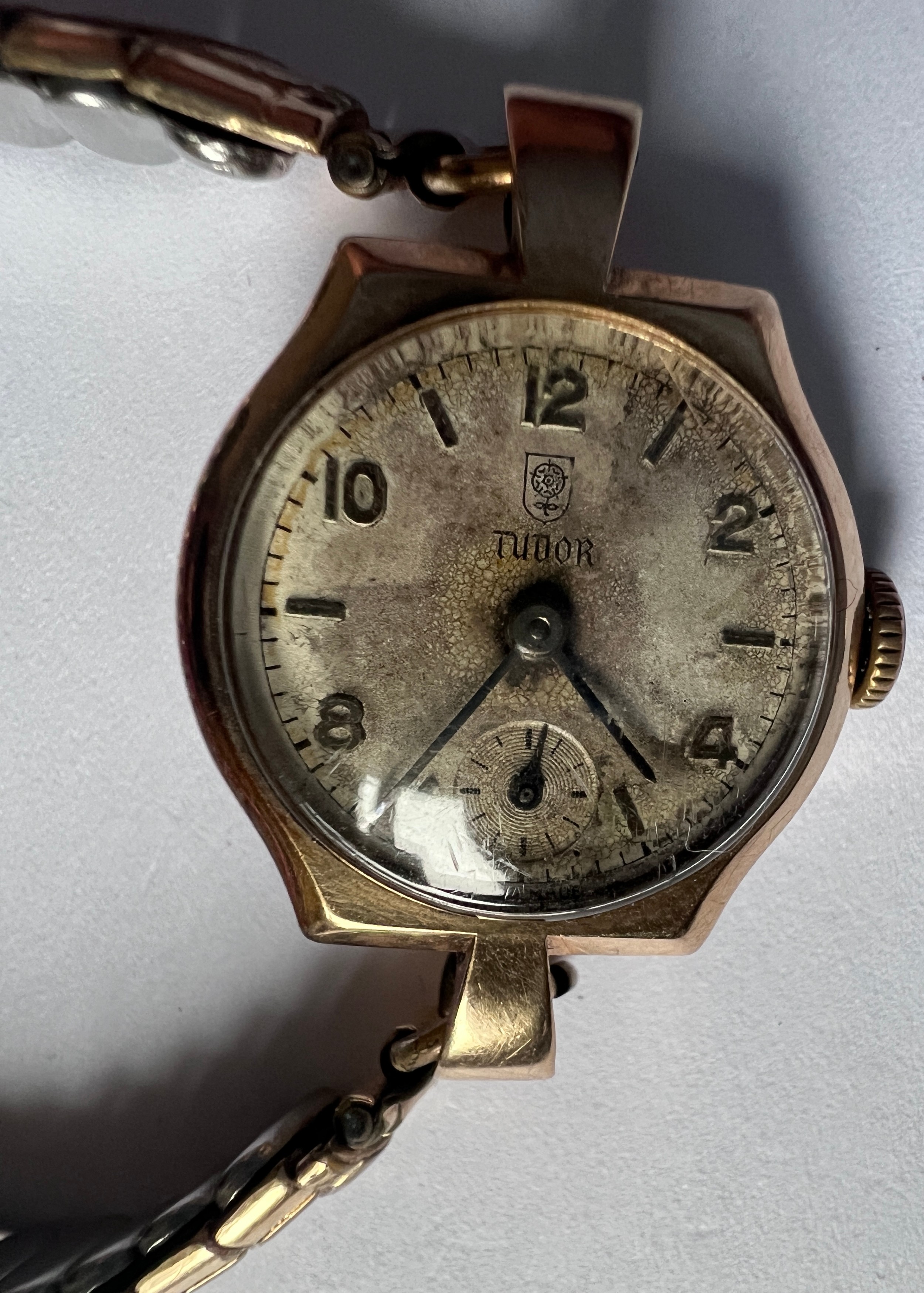 A vintage Tudor 9ct gold ladies wristwatch with subsidiary seconds dial on expanding gold plated