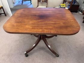An 18thC mahogany dining table base with later top. 112 l x 90 w x 76cm h.