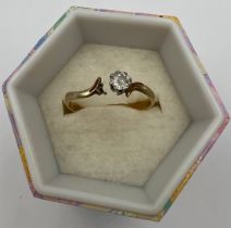 A solitaire diamond ring set in 18 carat yellow gold. Weight 1.6gm.