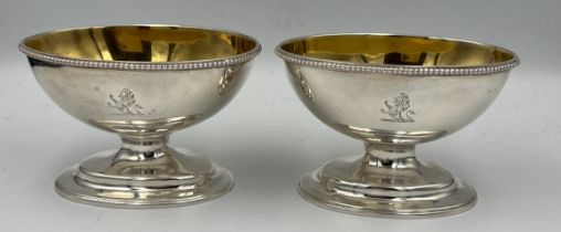 A pair of silver salts with gilt interiors and bearing crests to front, London 1807, maker