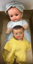 An Armand Marseille Doll, 39cm l, marked A.M. Germany 518/3/2K, with open mouth and eyes, dressed in