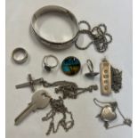 A quantity of mainly hallmarked silver jewellery to include hinged bangle, key pendant, locket,