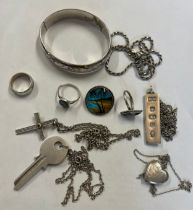 A quantity of mainly hallmarked silver jewellery to include hinged bangle, key pendant, locket,