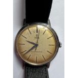 A 1950's Tudor shock resisting gentleman's wristwatch, gold numerals, gold hands on leather strap.