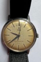 A 1950's Tudor shock resisting gentleman's wristwatch, gold numerals, gold hands on leather strap.