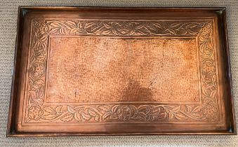 Copper tray by Keswick School of Industrial Art, a hammered centre with foliate border. Marked to