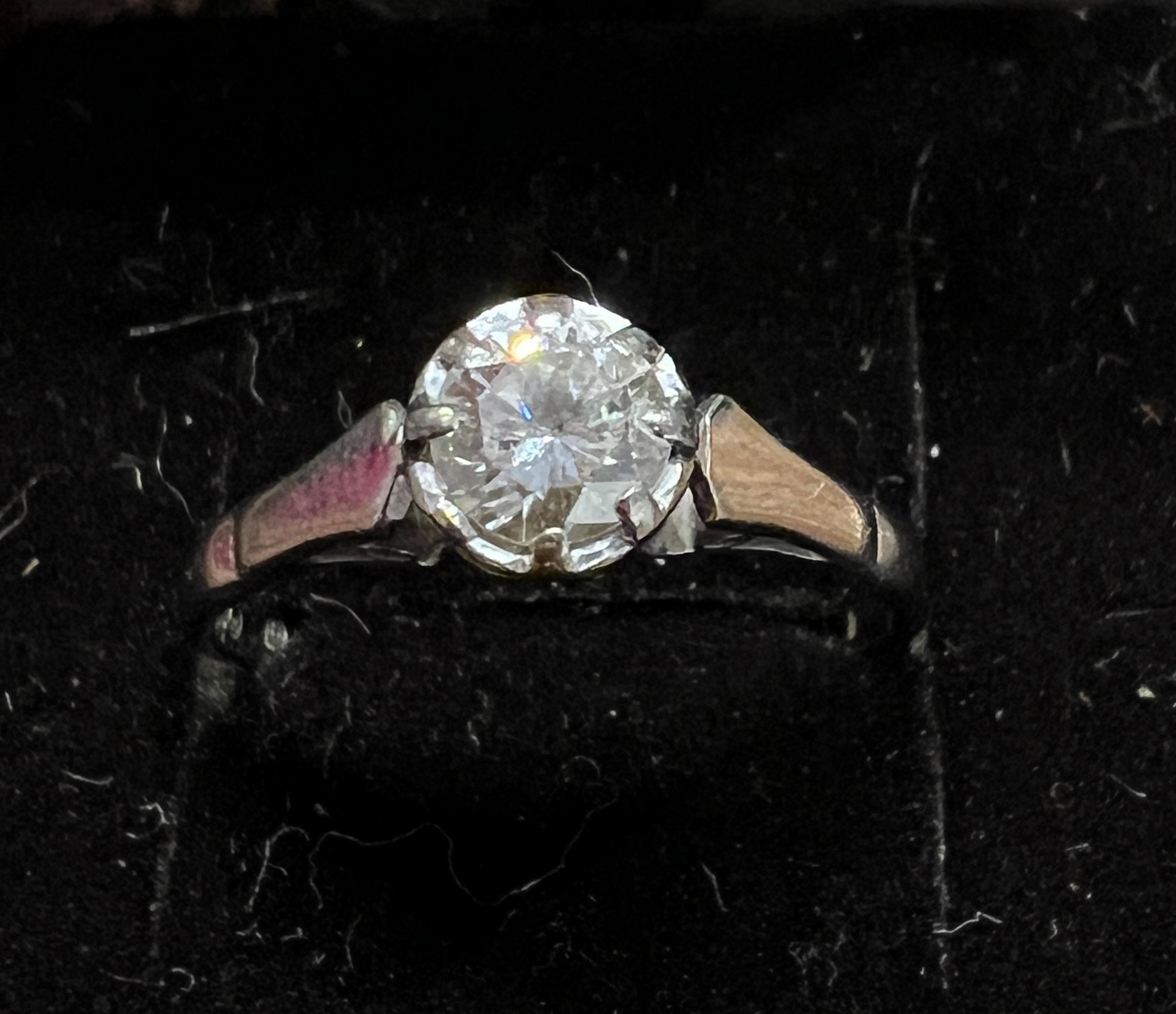 An 18 carat white gold solitaire diamond ring. Size L. Weight 2.6gm.