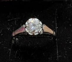 An 18 carat white gold solitaire diamond ring. Size L. Weight 2.6gm.