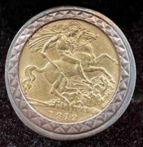 A 1912 gold half sovereign mounted in 9 carat gold as a ring. Total weight 9.6gm. Size W.