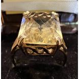 A 9 carat gold ring set with citrine. Size M. Weight 3.7gm.