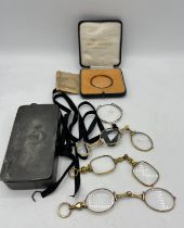 Early 20thC glasses and lens contained within a 19thC pewter box with a boxed twinsight toric