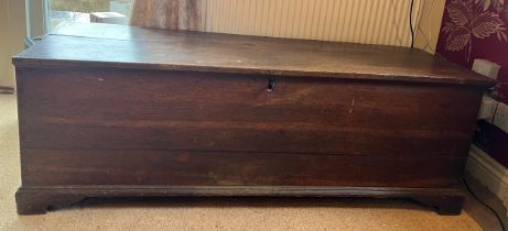 A 19thC oak chest with candle box. 129cm w x 42cm d x 43cm h.