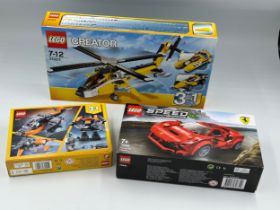 Three unopened Lego sets to include Lego Creator No. 31023, No. 31111 and Ferrari F8 Tributo No.