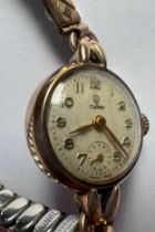 A vintage Tudor 9ct gold ladies wristwatch with subsidiary seconds dial on expanding gold plated