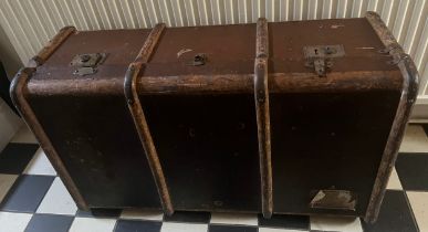 A vintage wooden bound trunk. Approximate size 91cm l x 54cm w x 32cm h. Together with some