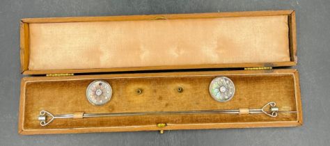 A pair of mother of pearl and diamanté hatpins in original fitted velvet and silk lined case. 22.5cm