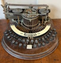 An American Hammond no. 12 typewriter on oak base. Approximately 38cm w.